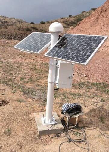 GNSS monitoring station deployed beside a cut slope